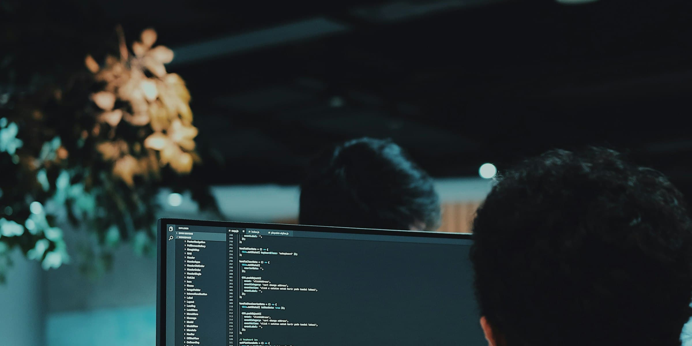 A developer working through code at a desk